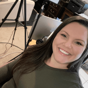 Denise smiling at her home office setup