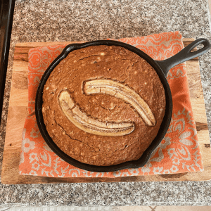 Homemade banana bread fresh from a cast-iron skillet
