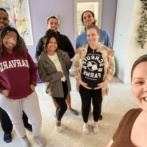 Denise with a group of friends at a gathering